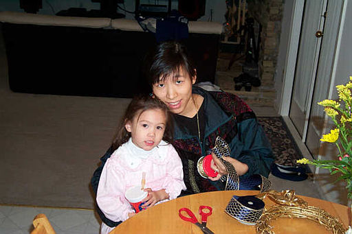 Mei and Jane busy making bows for the Christmas tree.