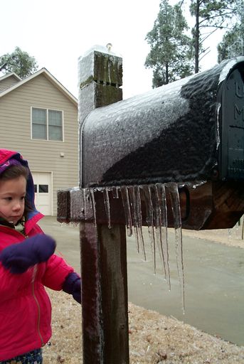 Jane grabbing for icicles